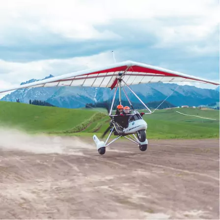 Image of a microlight taking off